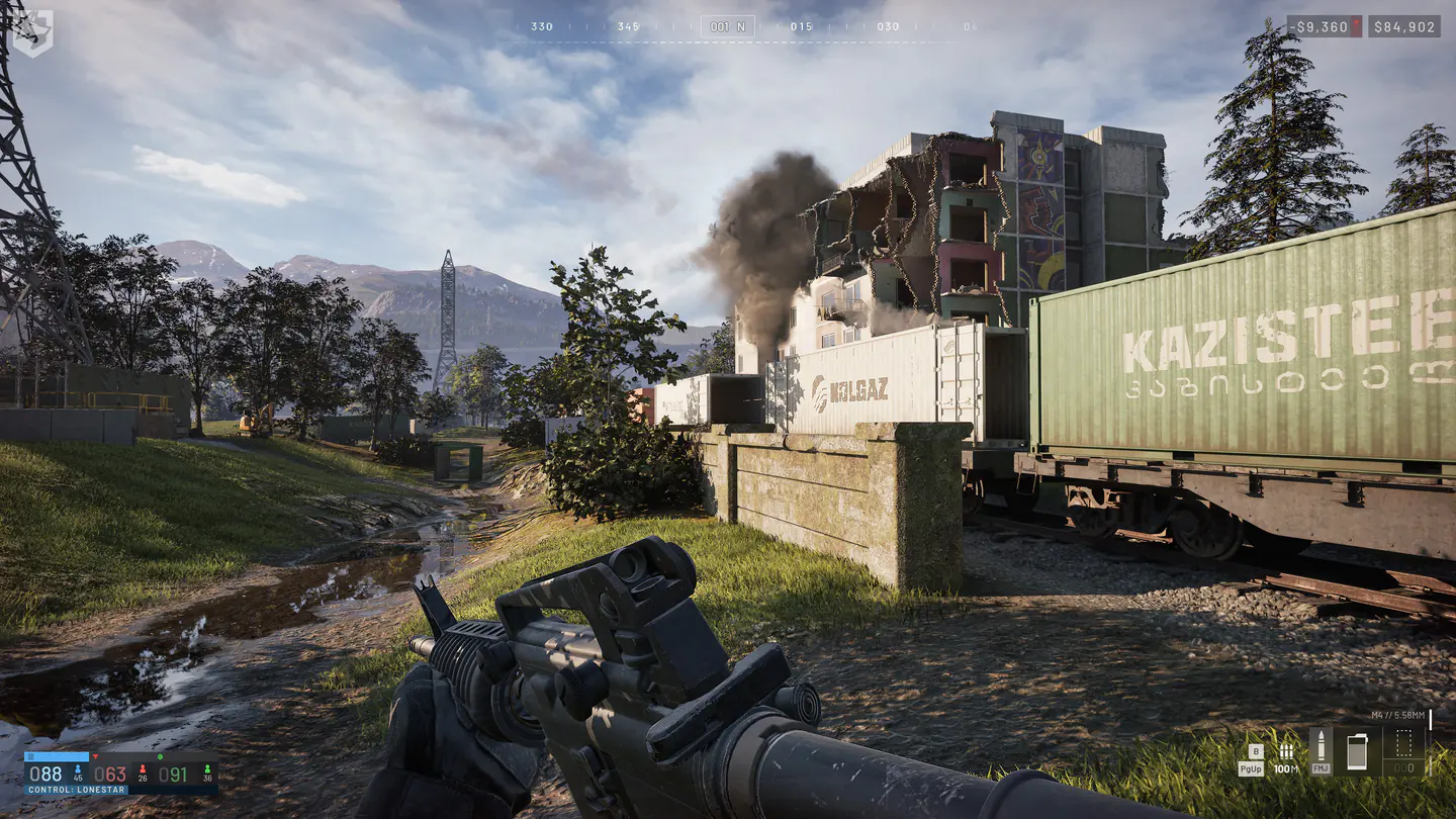 WARDOGS player facing a damaged building with Control Zone scores and cash visible on the HUD